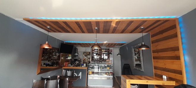 The counter and coffee station under the slatted ceiling